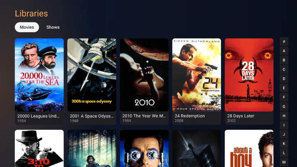 Google TV library grid of movie posters with an A to Z jump rail down the right edge.